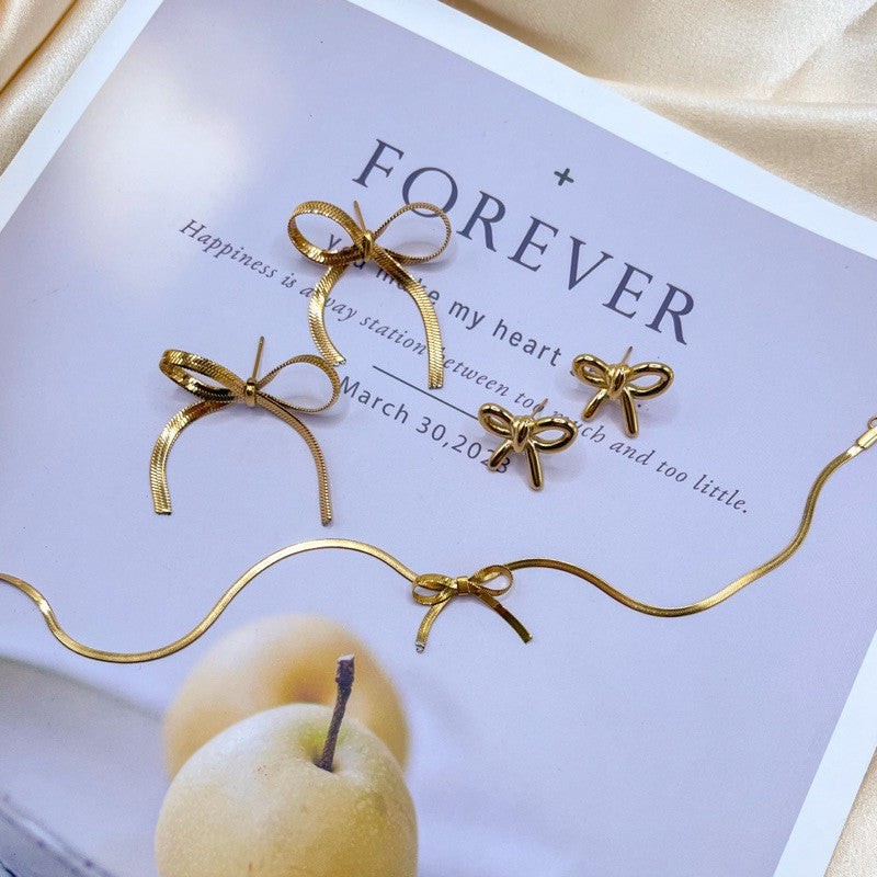 Stainless steel gold Bow earrings ribbon necklace/ gold neckalce
