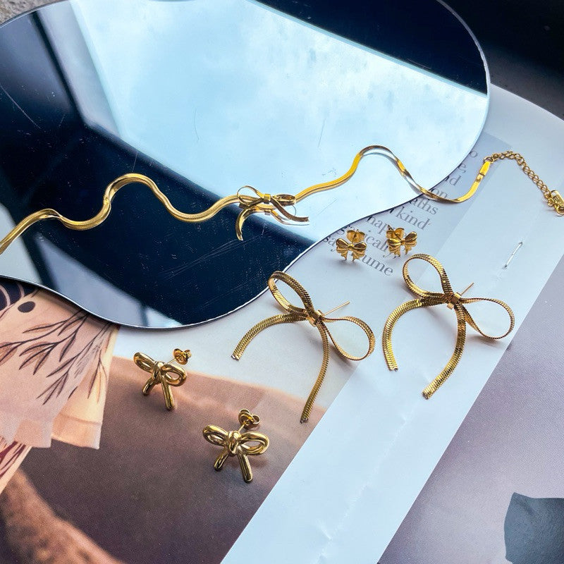 Stainless steel gold Bow earrings ribbon necklace/ gold neckalce